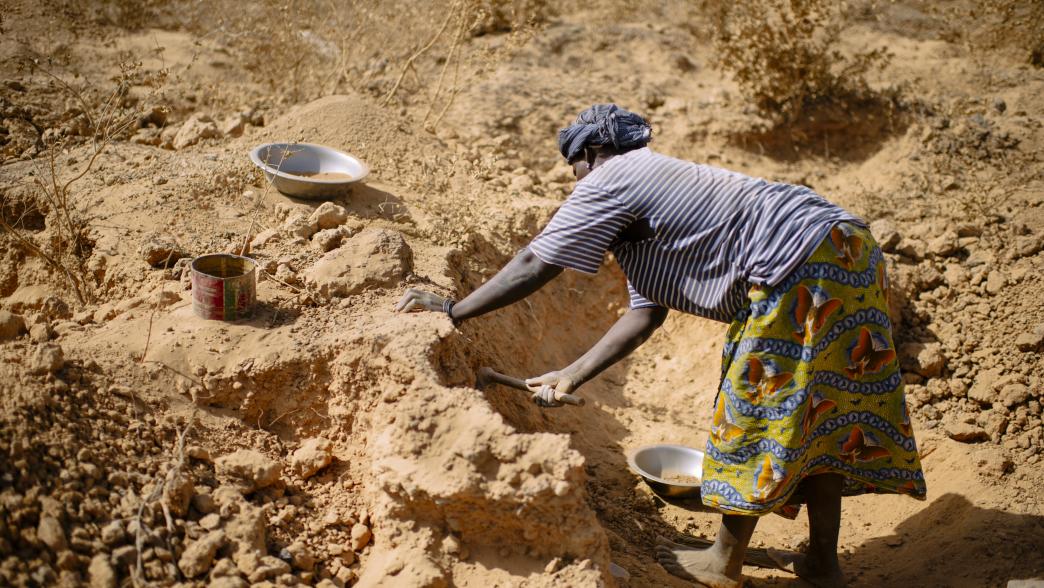 Female farmer gold mining in Burkina Faso