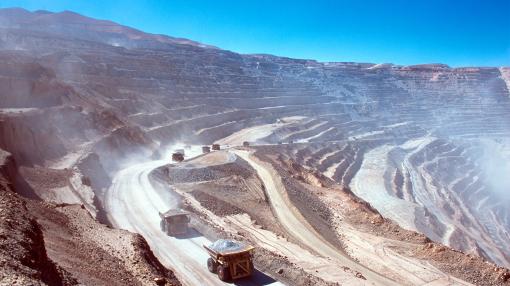 Ore trucks in an open-pit mine, Calama, Atacama desert. North Chile